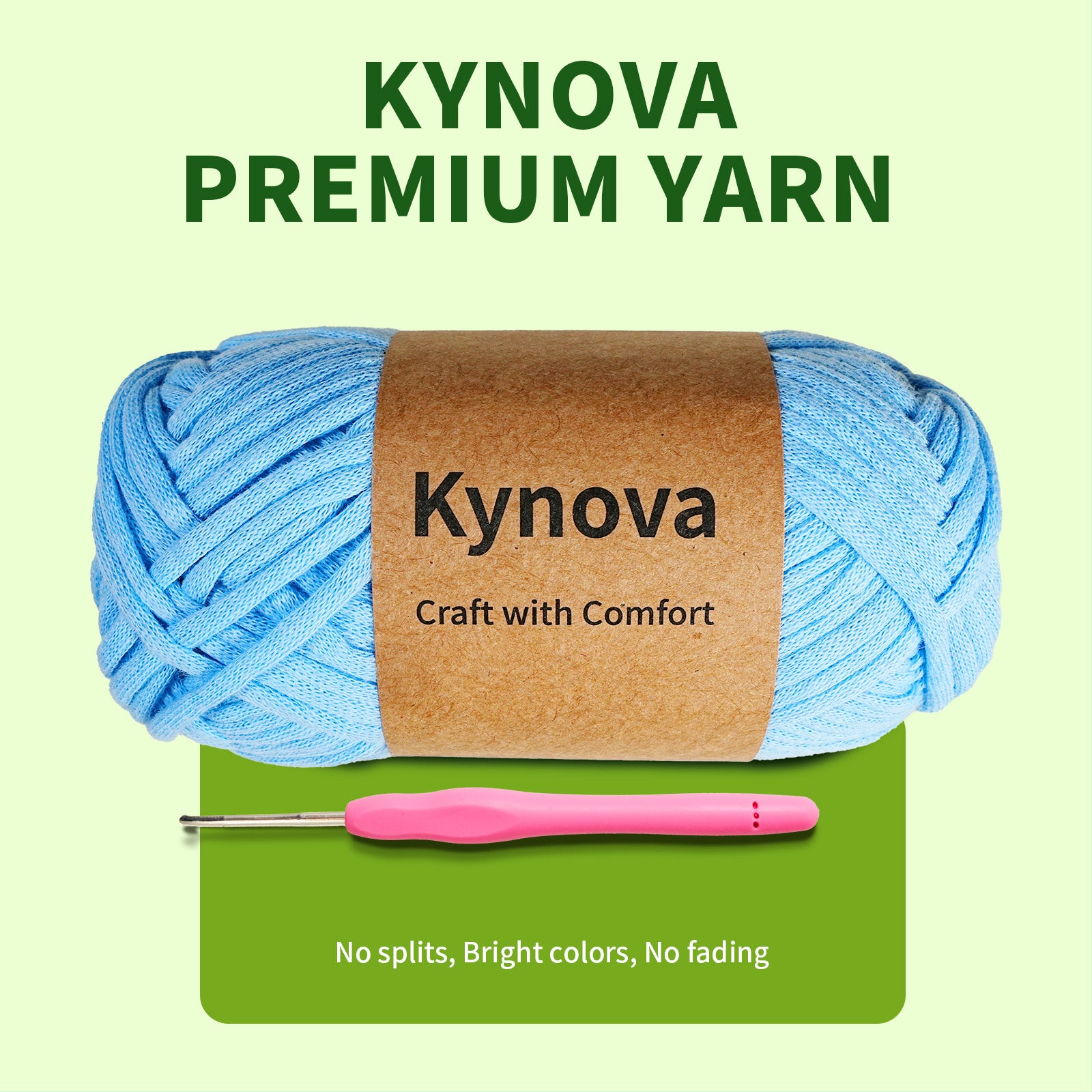 Blue yarn ball with Kynova label and pink crochet hook on green background