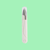 A white spring-loaded yarn scissors with a non-slip side design and a protective cap on the blade.