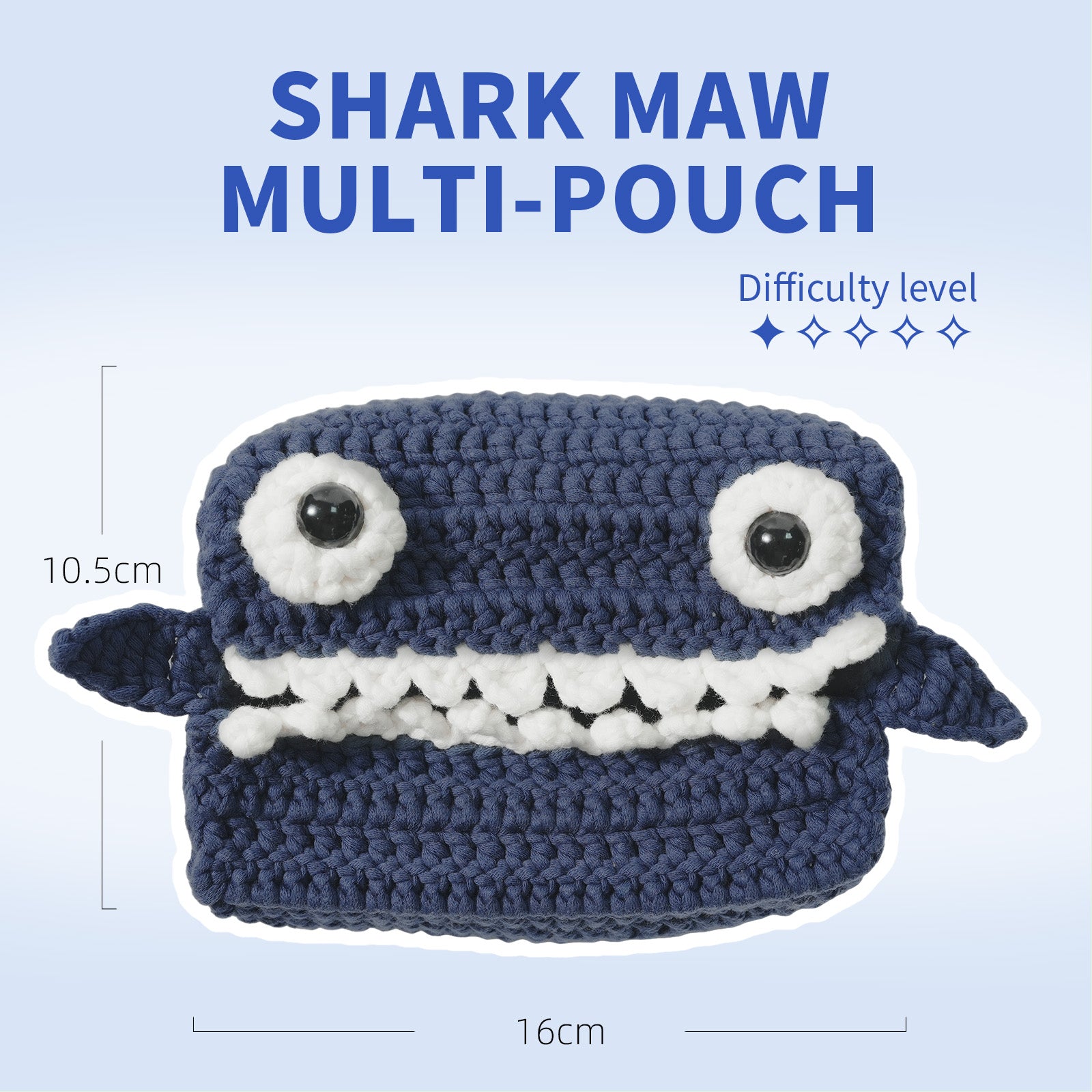 Crocheted shark-shaped multi-pouch with measurements on a light blue background