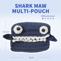 Crocheted shark-shaped multi-pouch with measurements on a light blue background